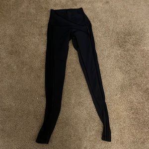 Black Lululemon leggings with seethrough sides